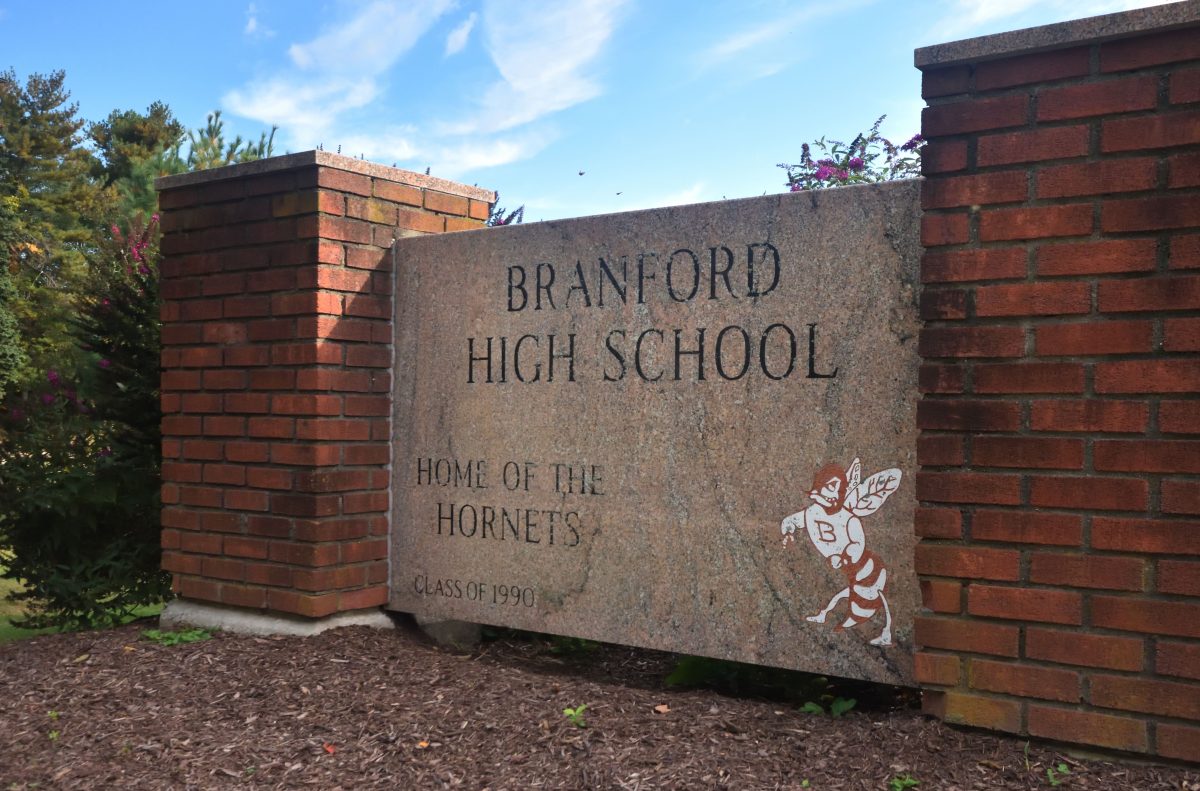 The granite sign outside Branford High School welcomes everyone to the home of the Hornets.