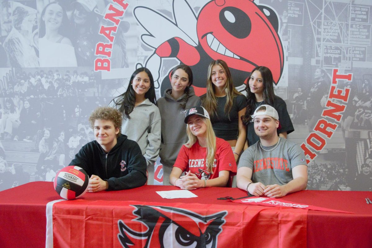 Stella Andresen, center, takes time to pose with family and friends during the recent signing day ceremonies at BHS.