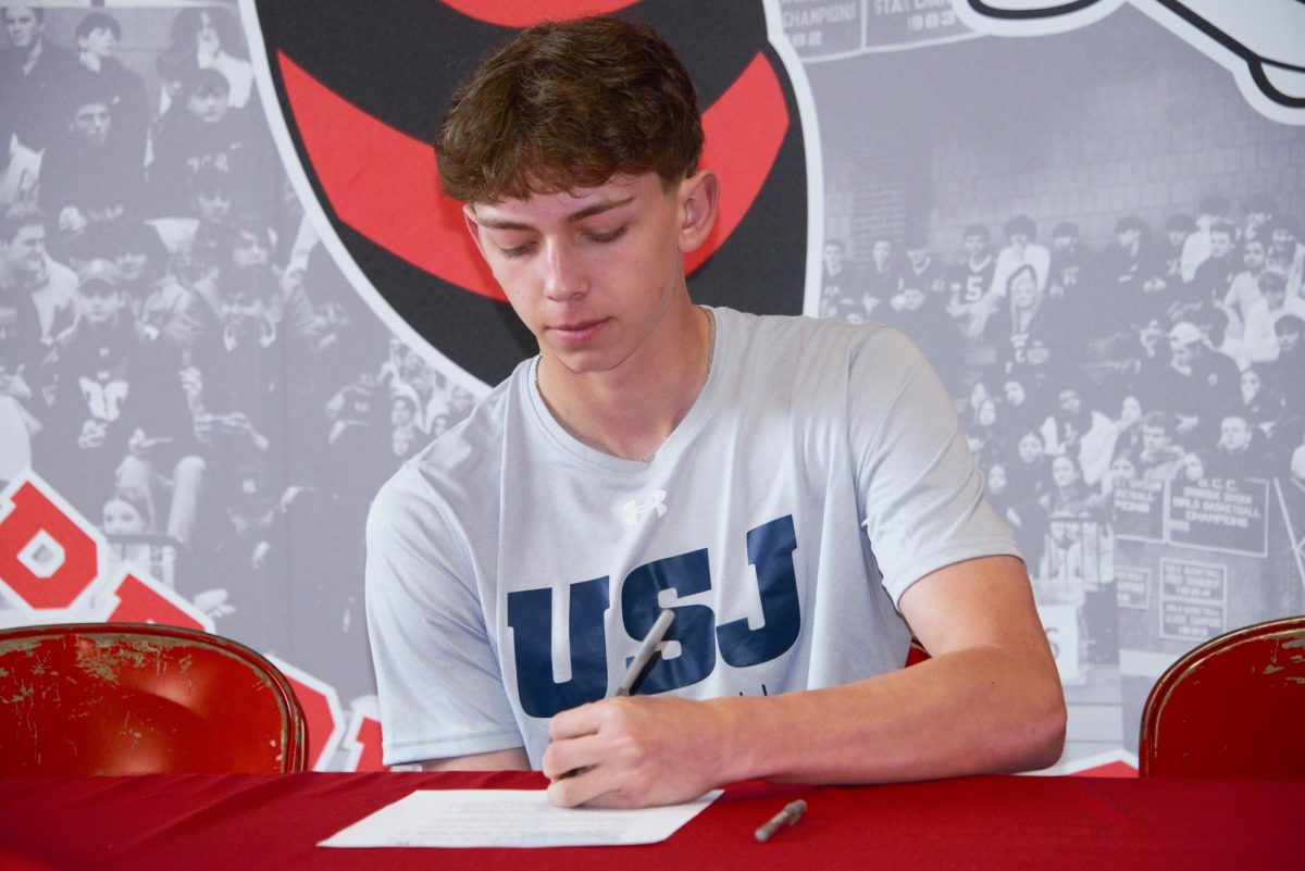 Trevor Cser signs to continue playing baseball next year at the University of St. Joseph.