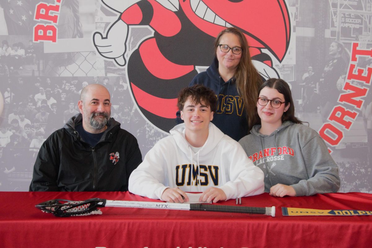Keegan Walsh and his family pose during this week's ceremonial signing day at BHS.