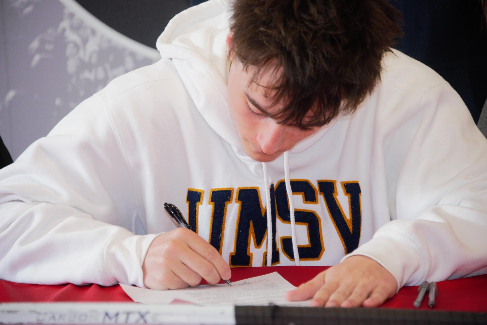 Keegan Walsh signs on to continue playing lacrosse next year at the University of Mount St. Vincent in New York.