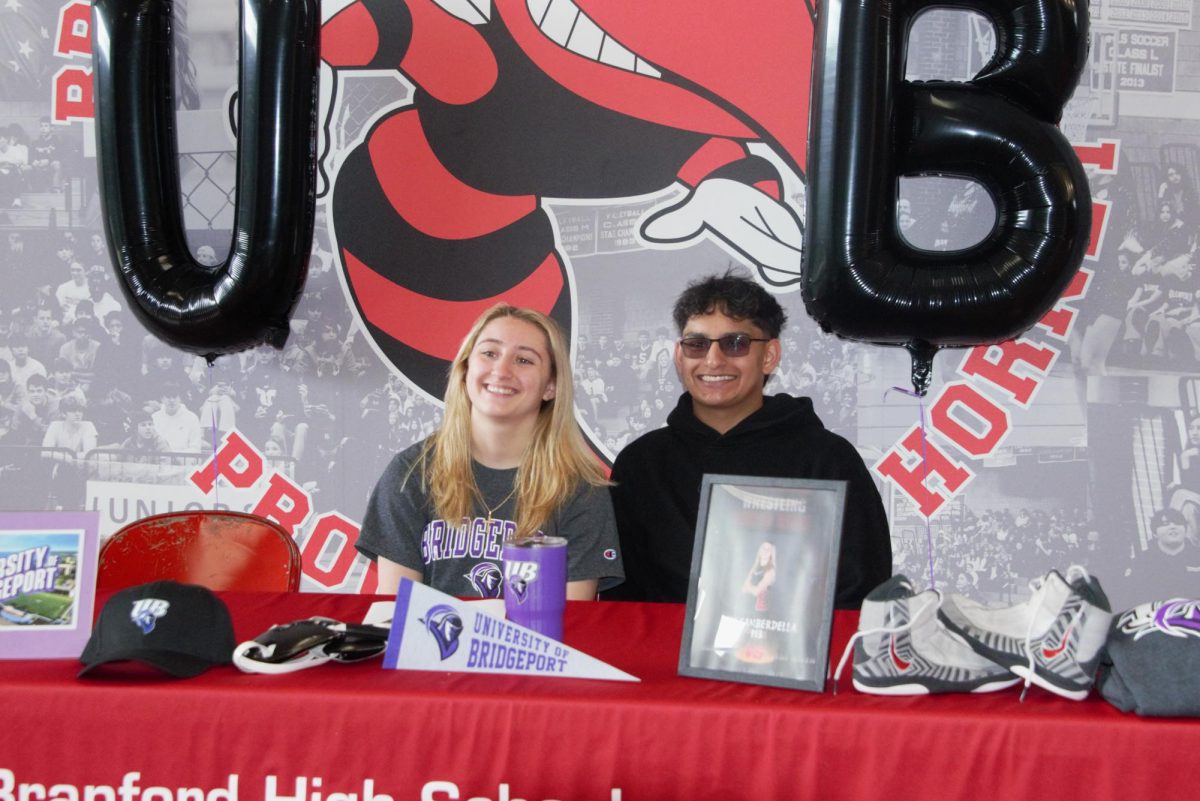 Ava Gamberdella, who plans to wrestle next year at the University of Bridgeport, poses with friend Samarvir Pamma.
