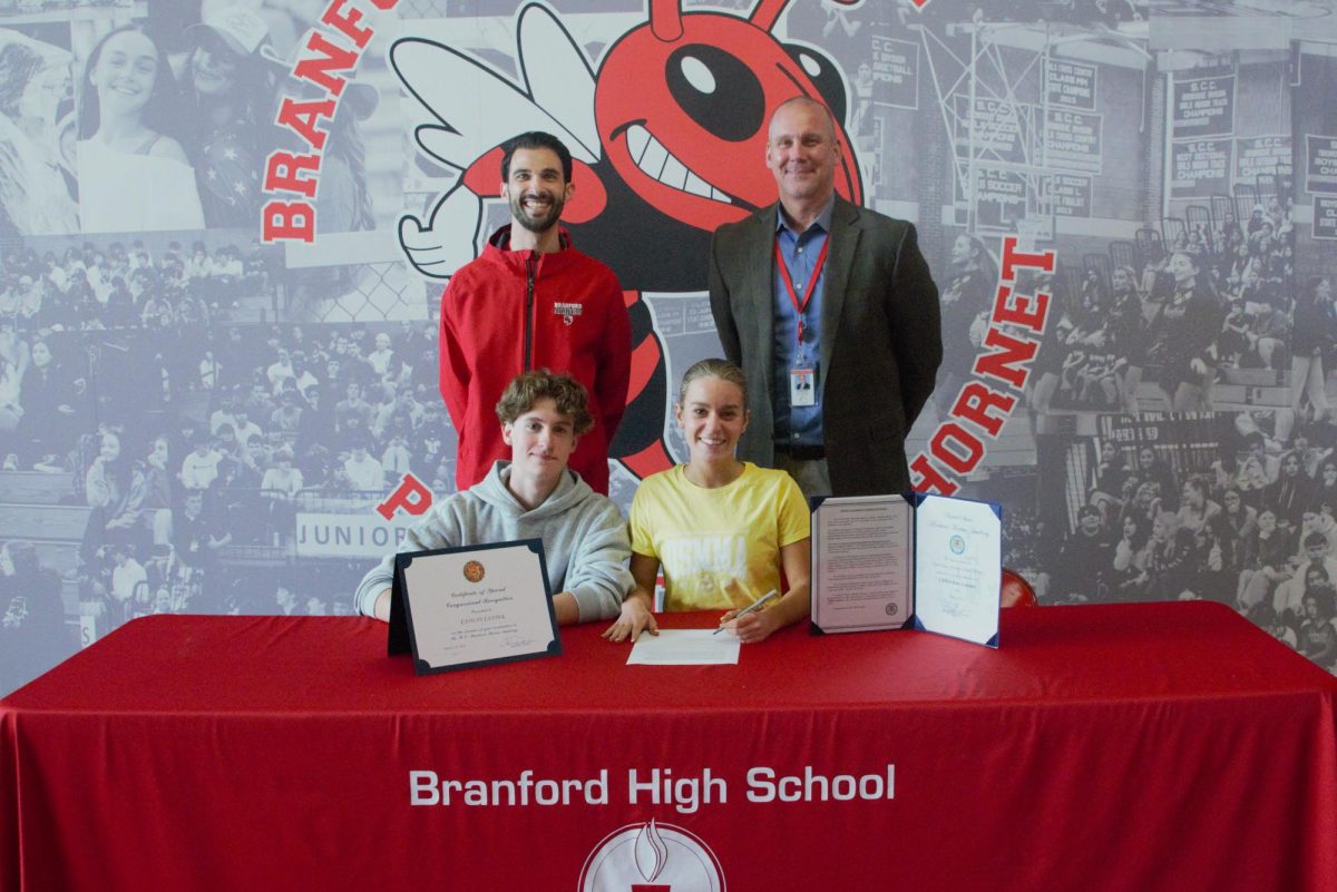 Branford High School held its ceremonial spring signing day this week, when eight student athletes officially announced they planned to continue playing sports in college.