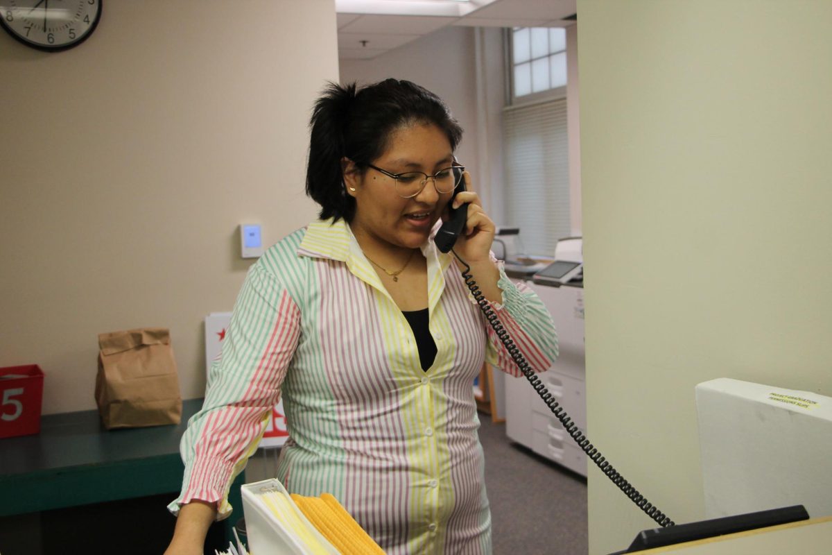 Senior Angelica Pagan Amon delivers the morning announcements to the school via the PA system.