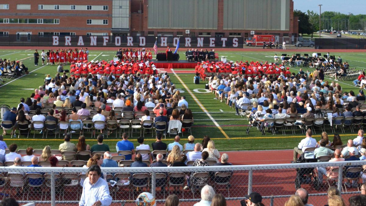 The Class of 2026 and spectators watch on as a speaker addresses the crowd on Jun 10.